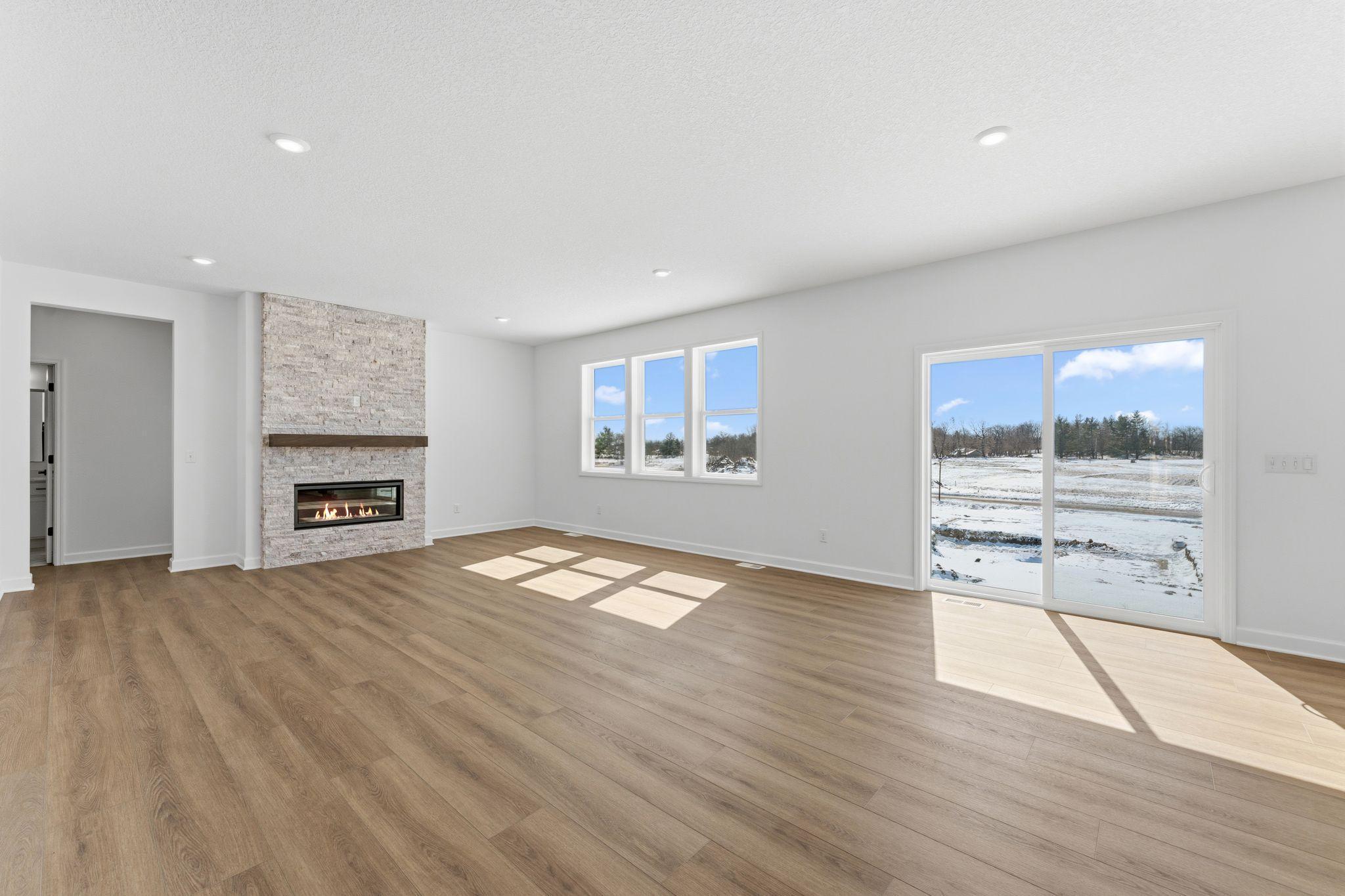 Enjoy shared moments with loved ones in the comfortable and spacious Great Room, where expansive windows flood the space with natural light.