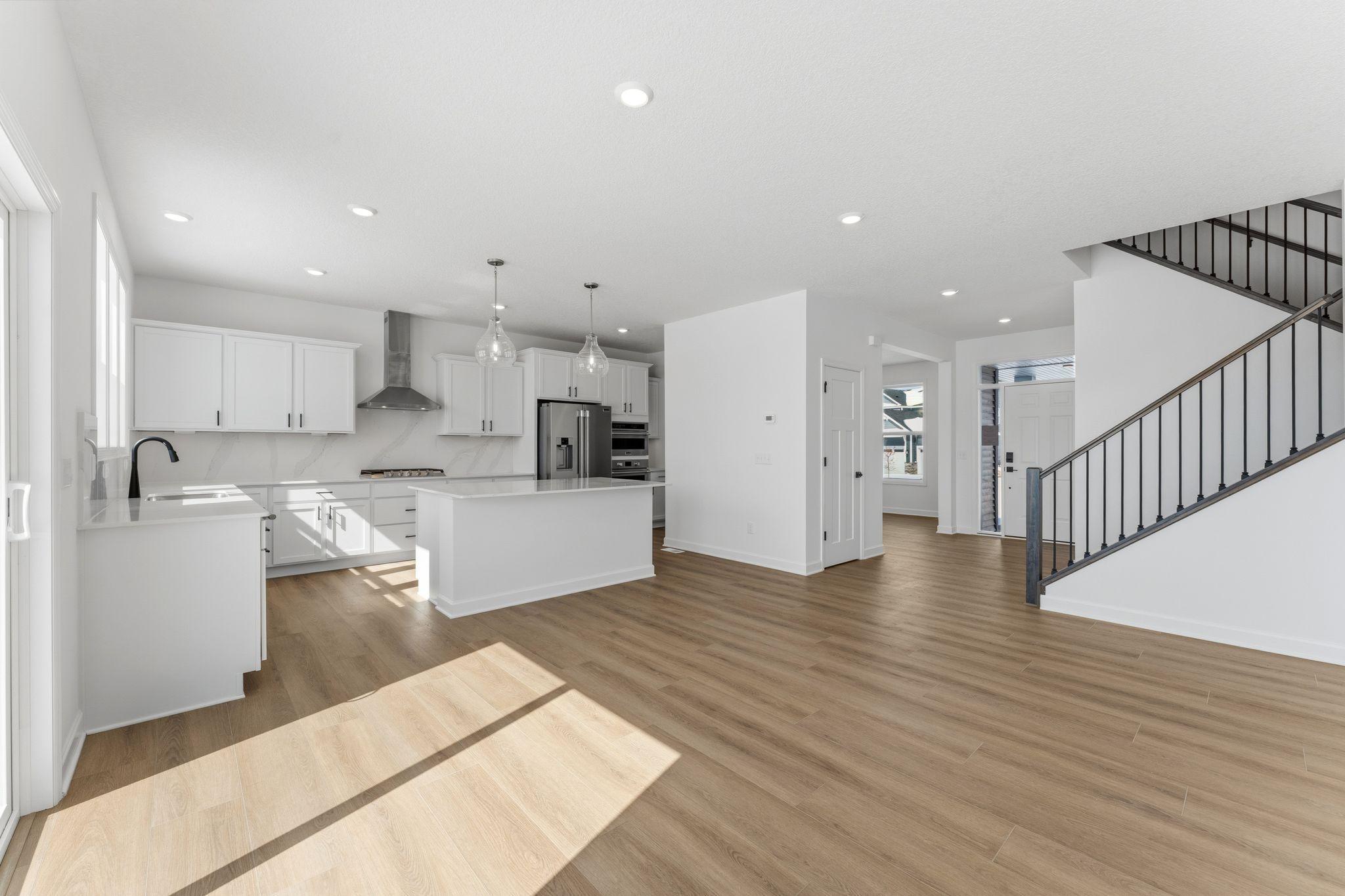 The breakfast room provides a convenient spot for casual meals and friendly conversations between the kitchen and family room.