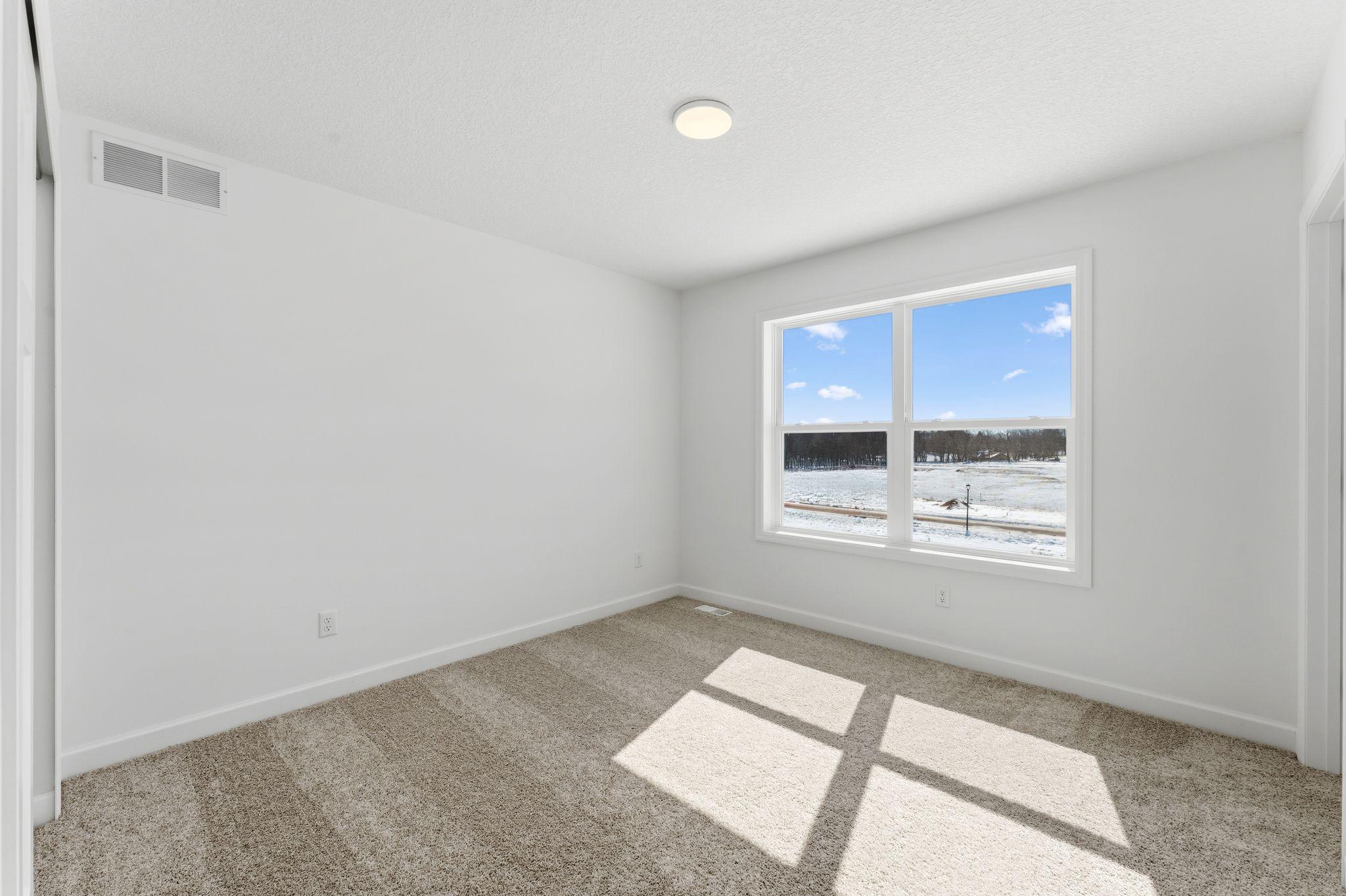 The secondary bedrooms provide comfort and privacy.