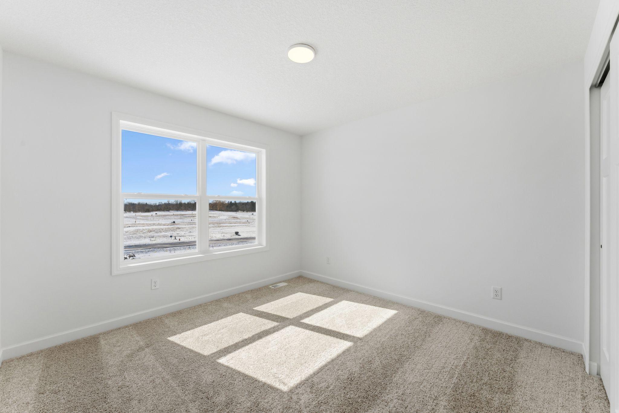 This secondary bedroom has it's own ensuite bathroom.
