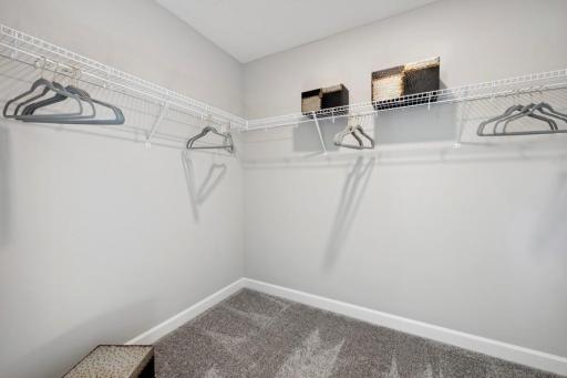 (Photo of a decorated model, actual features will vary) The owner's suite features an incredible walk-in closet.