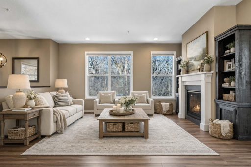 Warm and inviting great room with fireplace and wooded views. Virtually staged to show possibilities.