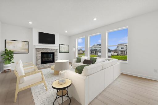 (Photo of similar home, finishes will vary) Notice the stunning natural light pouring into this spacious family room. Plus, the beautiful gas fireplace.