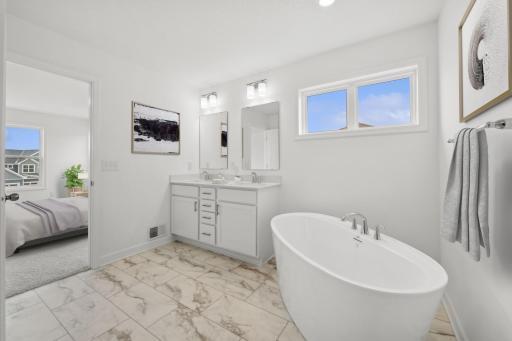 (Photo of similar home, finishes will vary) Another view of the primary bath.