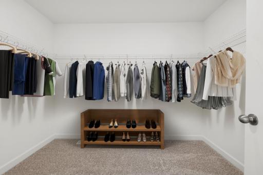 (Photo of similar home, finishes will vary) The primary bedroom closet.