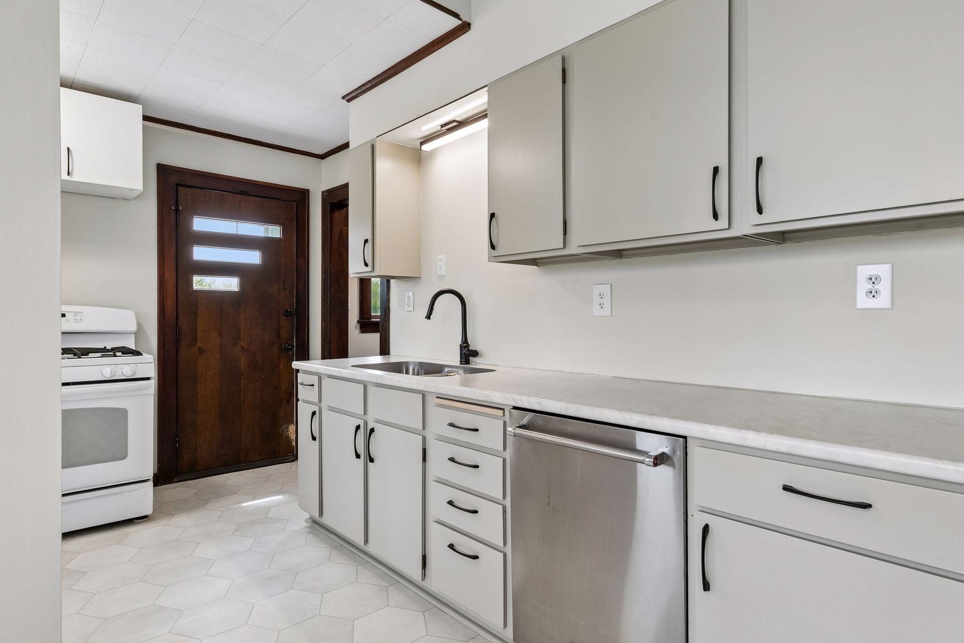 Kitchen offers a walkout to the rear deck and backyard.