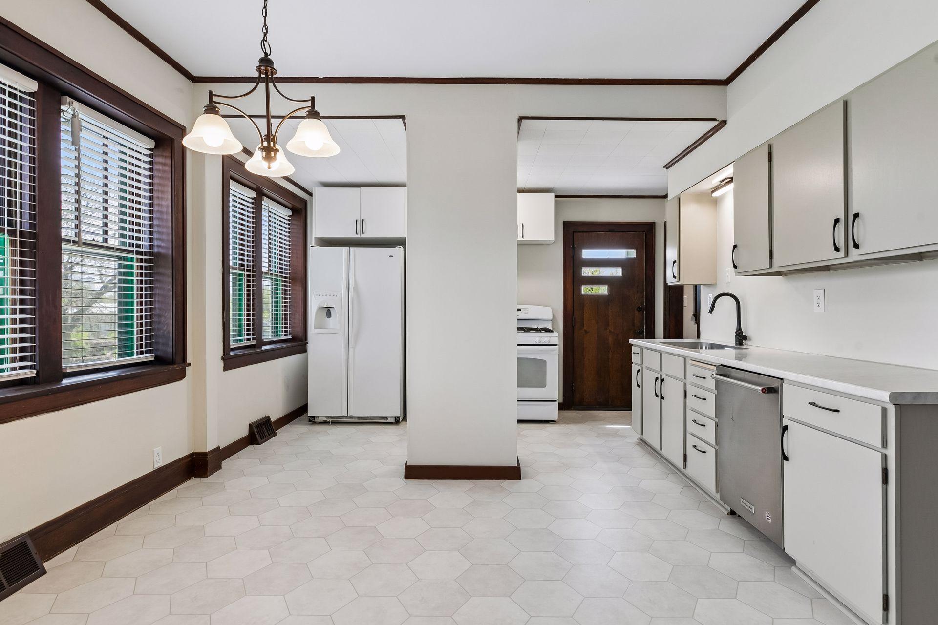 Expansive eating-in kitchen with wall of east facing windows - wonderful natural light floods the space.