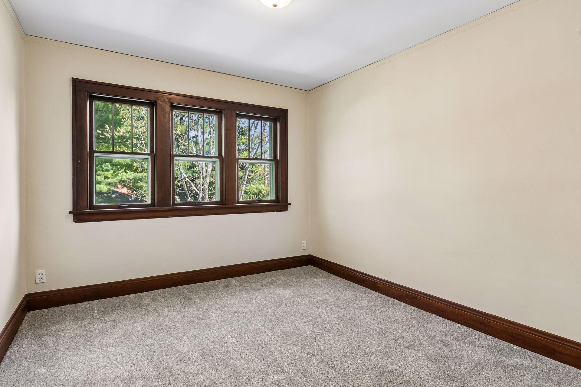 One of three upper level bedrooms. All bedrooms have brand new carpet and paint.