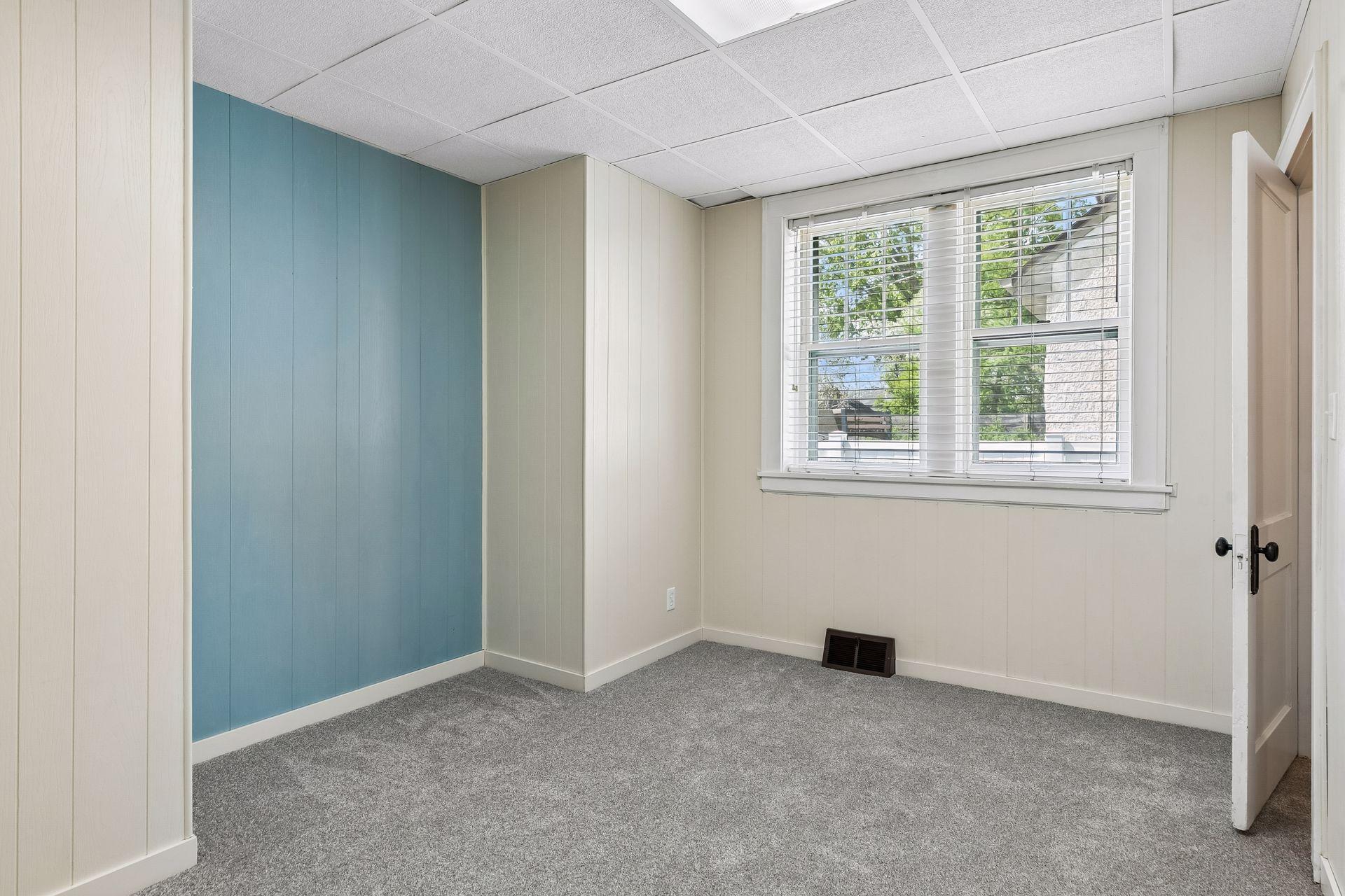 Main floor bedroom with brand new carpet and half bath.