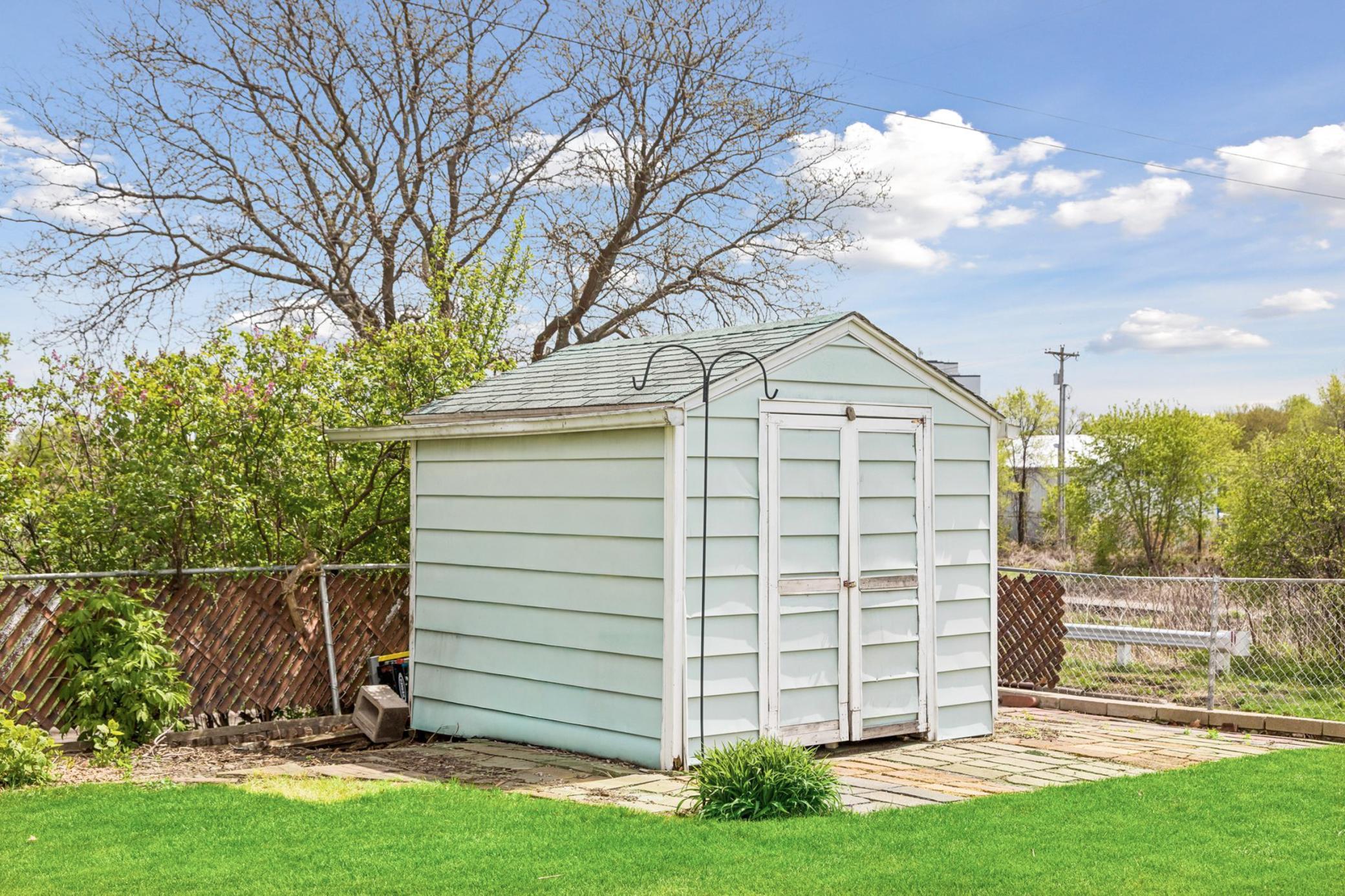 Additional storage shed to the oversized 2 car garage.