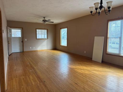 Main floor living room with front porch on far end of photo