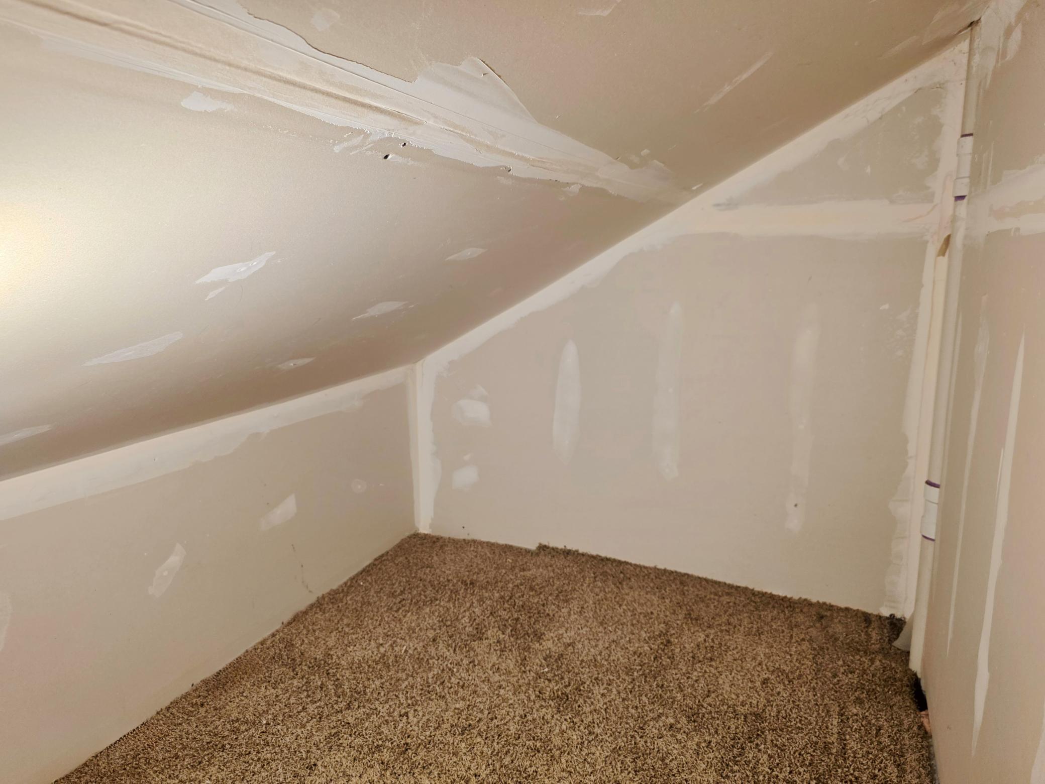 Another storage area upstairs accessed from hallway