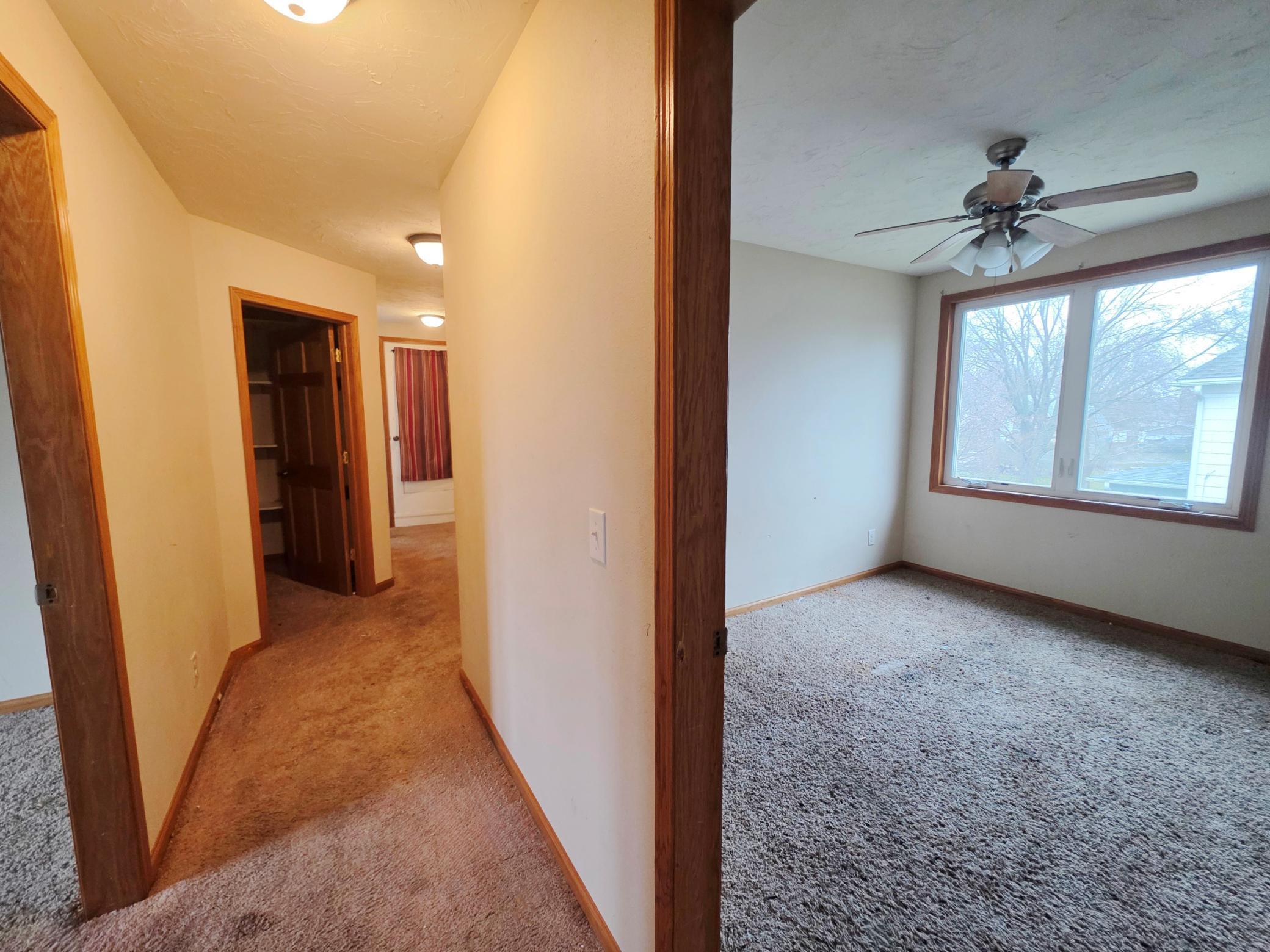 Hallway upstairs showing one of the three upstairs bedrooms