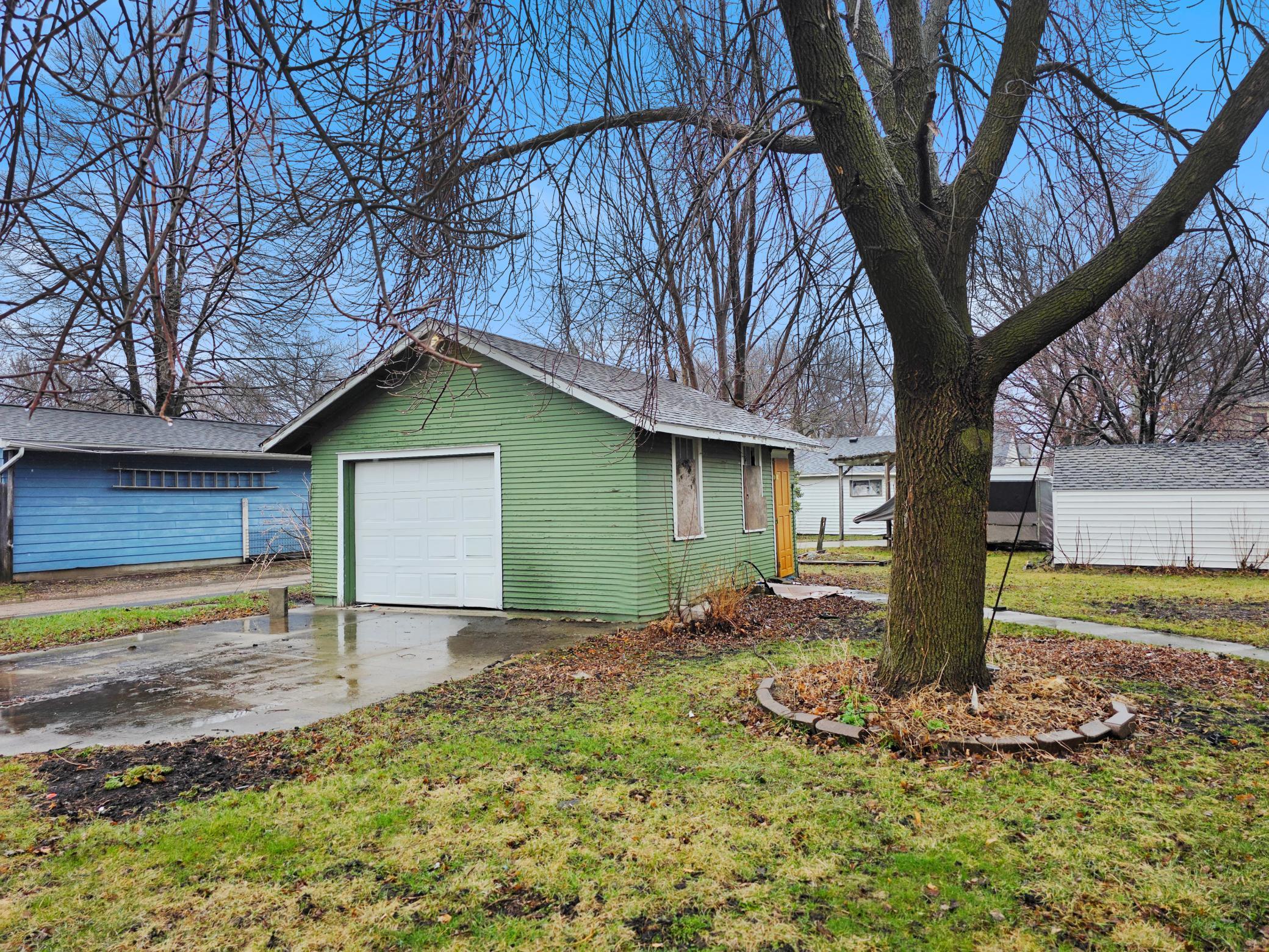 Backyard is host to the one-car garage just off the alley