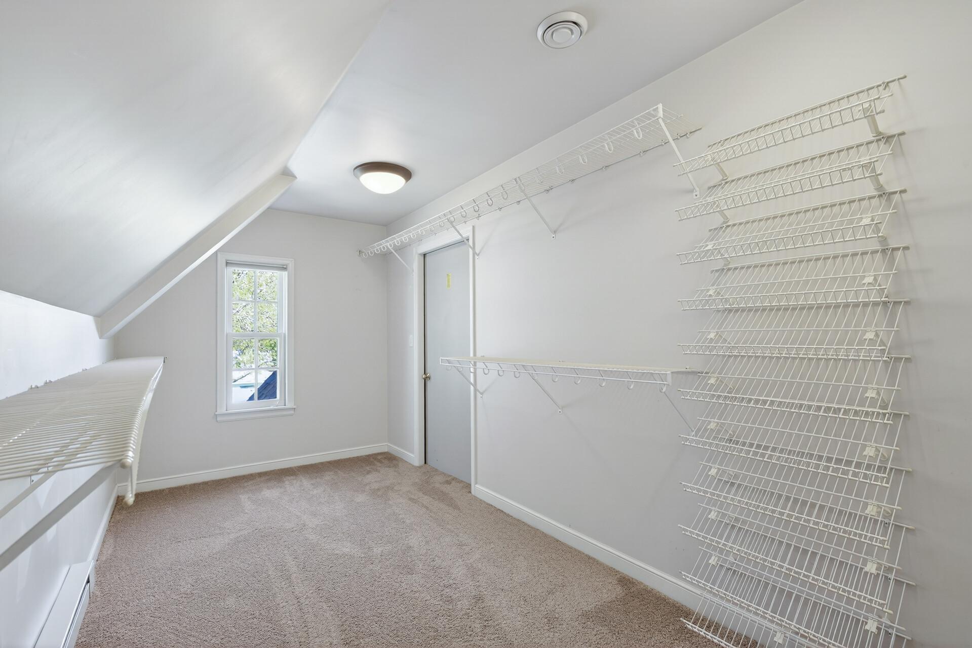 Upper level primary walk-in closet