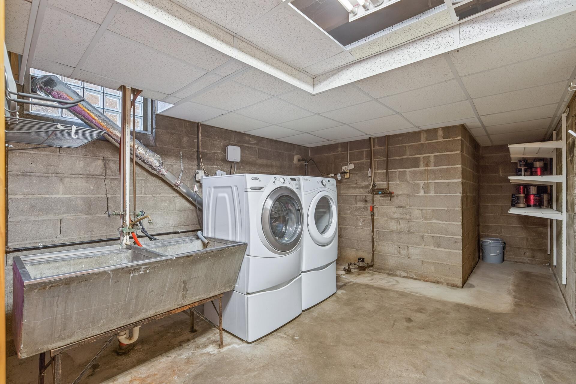 Lower level laundry, adjacent to mechanical/storage