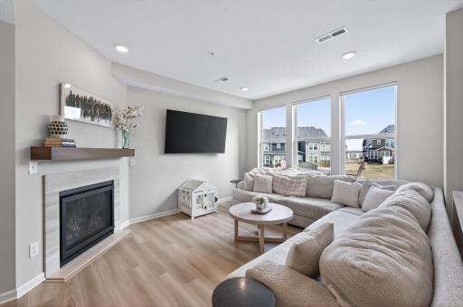 Natural light cascades through the huge picture windows.