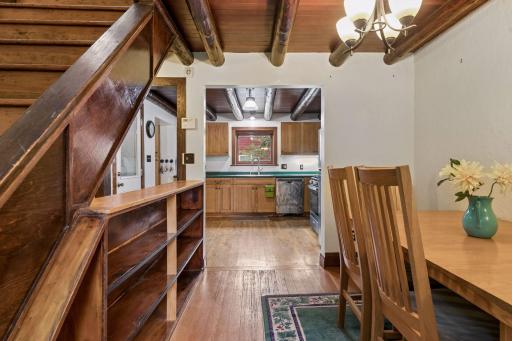 View from dining room. Built in bookcase by staircase.