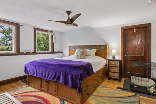 Light filled primary bedroom with two large walk in closets.