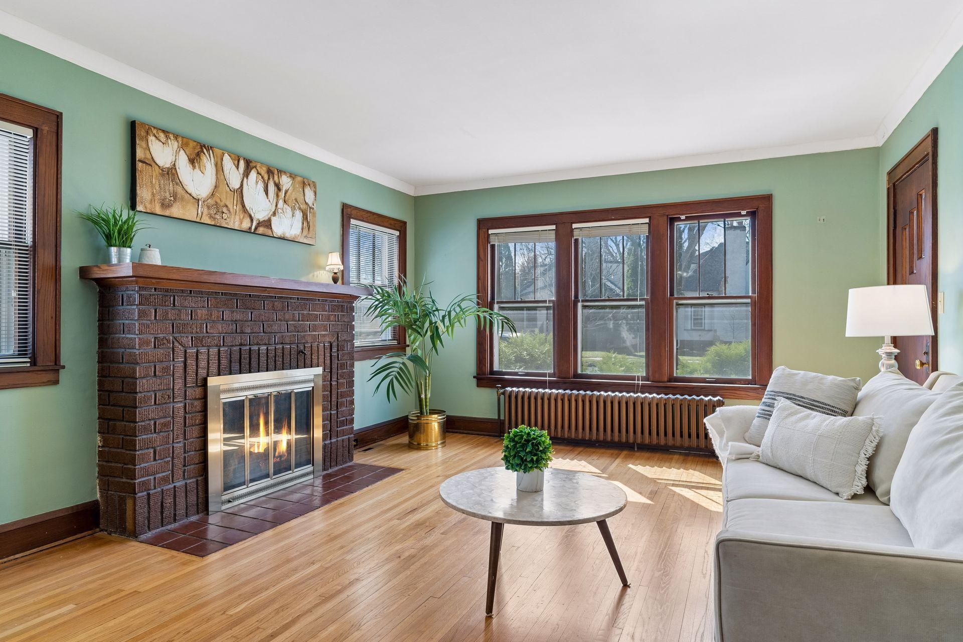 Wood burning fireplace with brick surround.