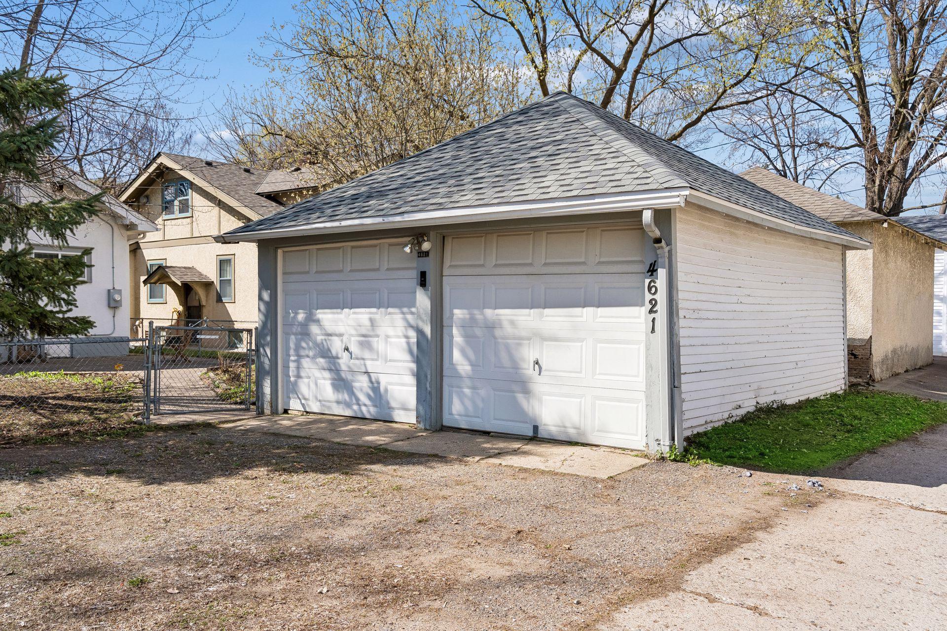 2 car garage with parking space in front.