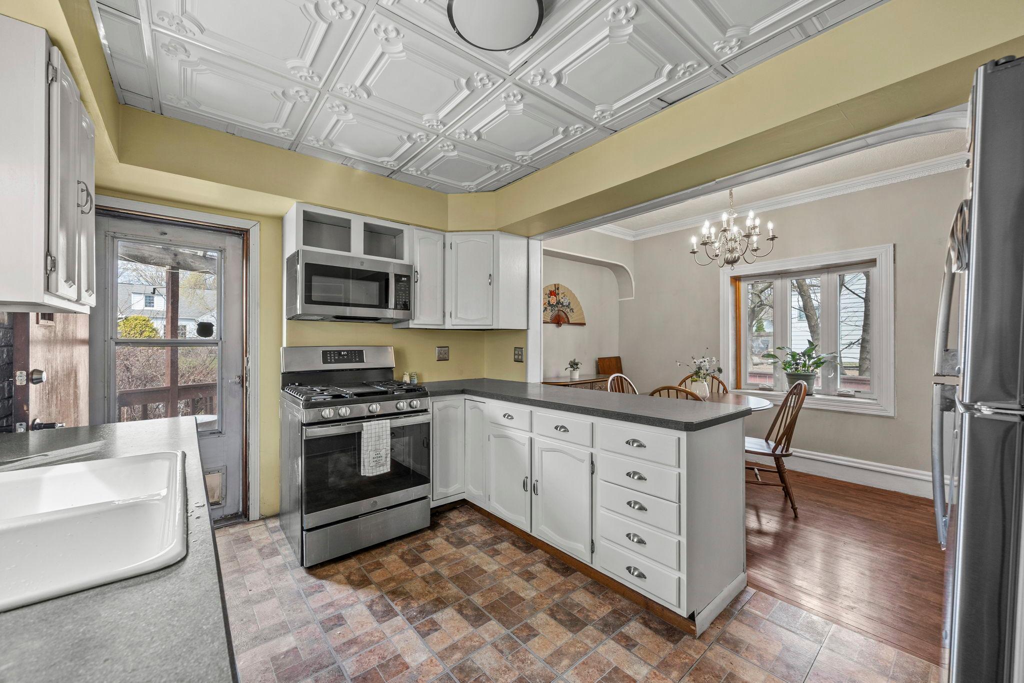 Walk out the back door to the large deck and backyard.