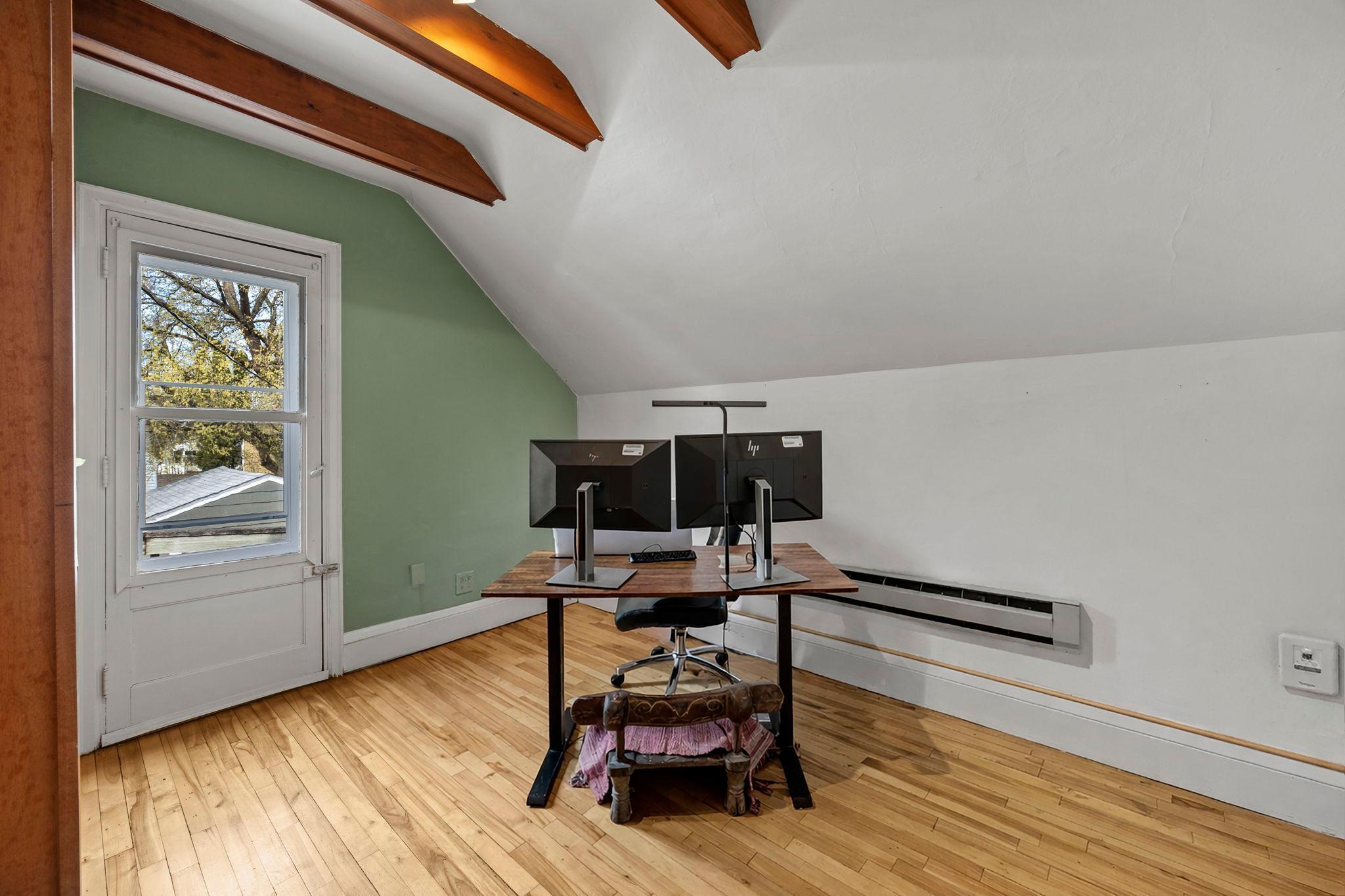 The second bedroom also has great storage and beautiful floors, and walks out to the upper deck.