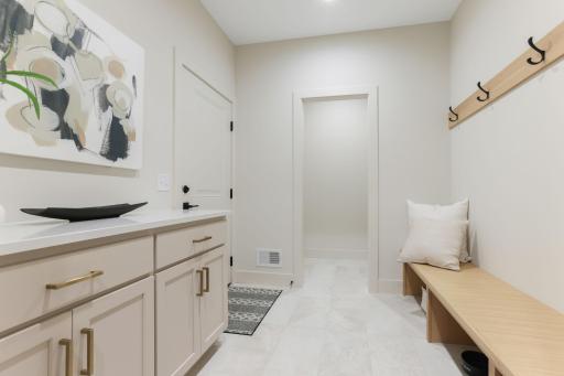 The mudroom is a perfect blend of practicality and finesse, designed to handle the demands of everyday life with ease.