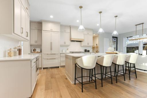 The heart of the home is a beautifully appointed gourmet kitchen.