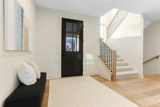Thoughtfully designed with timeless architecture and refined finishes, this stunning two-story home offers 6 bedrooms and 5 bathrooms with impeccable craftsmanship throughout.