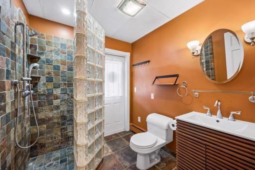 Lower level 3/4 bathroom-this bath has its own entrance to outside. Perfect for pool parties!