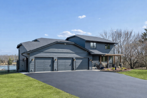 Beautifully redone exterior with pergola over front porch! Photo has been staged with a resurfaced driveway.