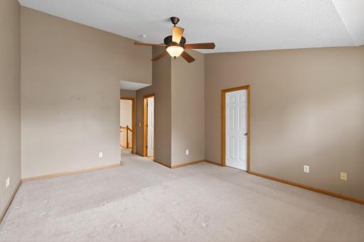 Oversized primary retreat offering comfort, natural light, and a relaxing atmosphere.