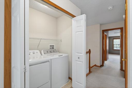 Upper-level laundry area adds practicality and convenience to daily routines.