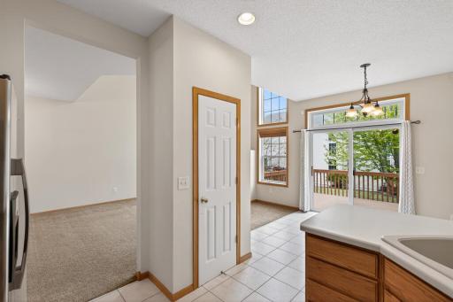 Light-filled dining area with deck access makes indoor-outdoor entertaining simple and convenient.