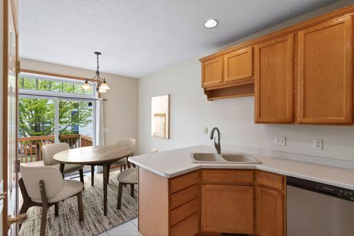 Perfect spot for morning coffee or casual dinners with peaceful backyard views and easy access to outdoor living space. Virtually Staged