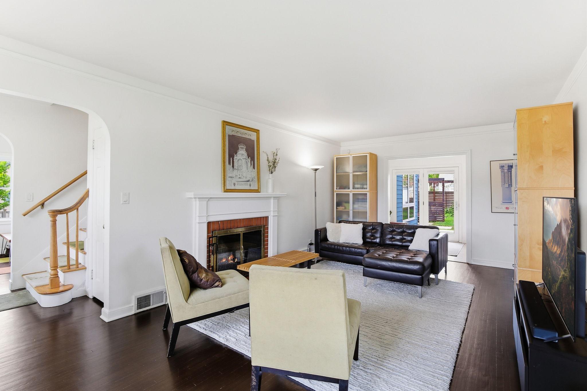 Main floor living room with cozy fireplace!