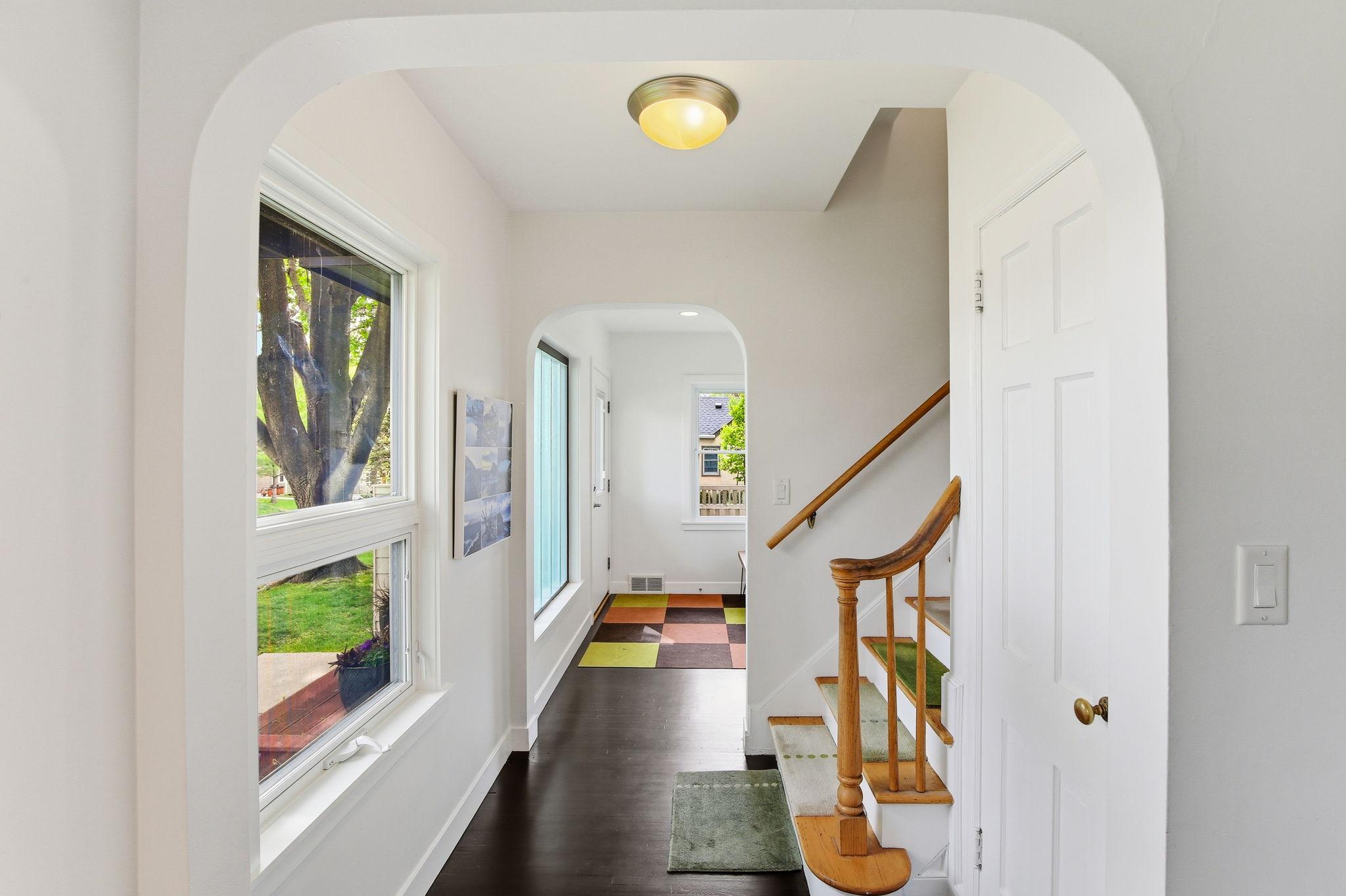 Looking towards the front entrance and beautiful staircase!