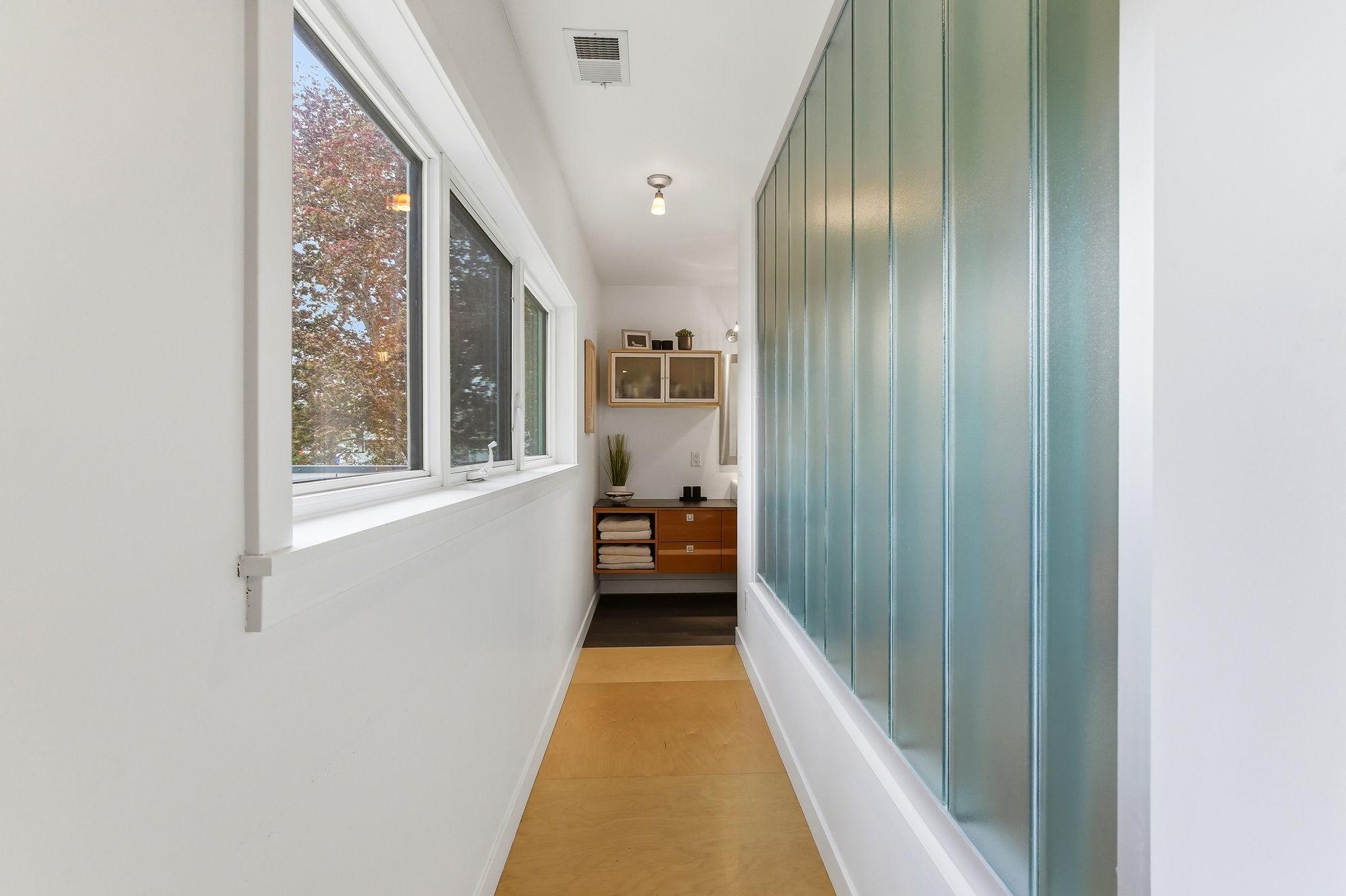 Primary suite hallway to private bath!