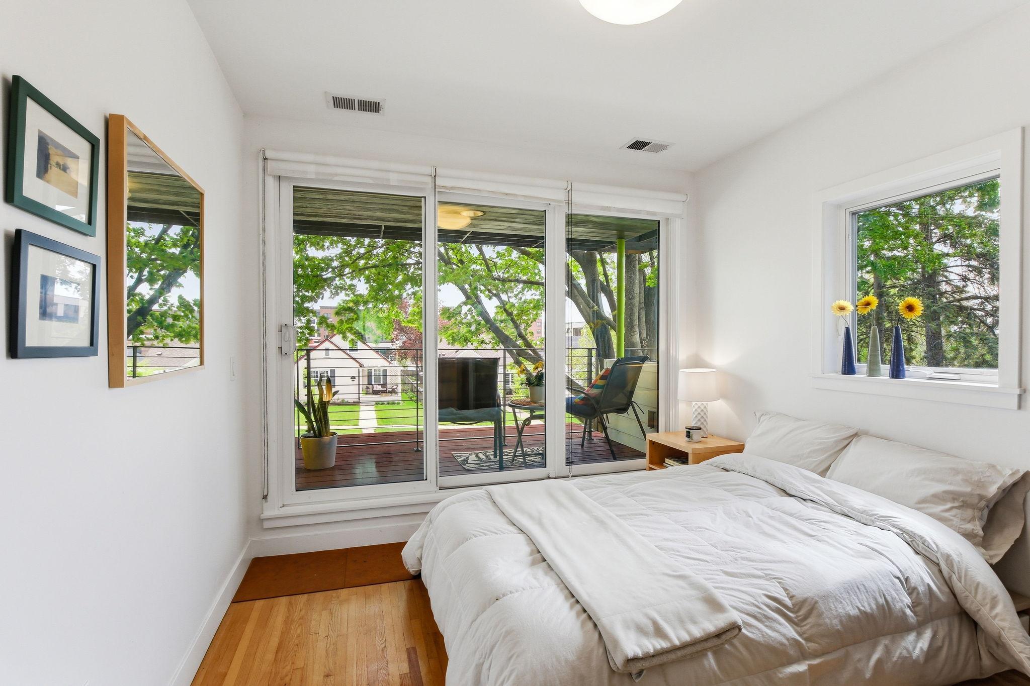 There are 4 bedrooms upstairs including this one with a fun balcony!