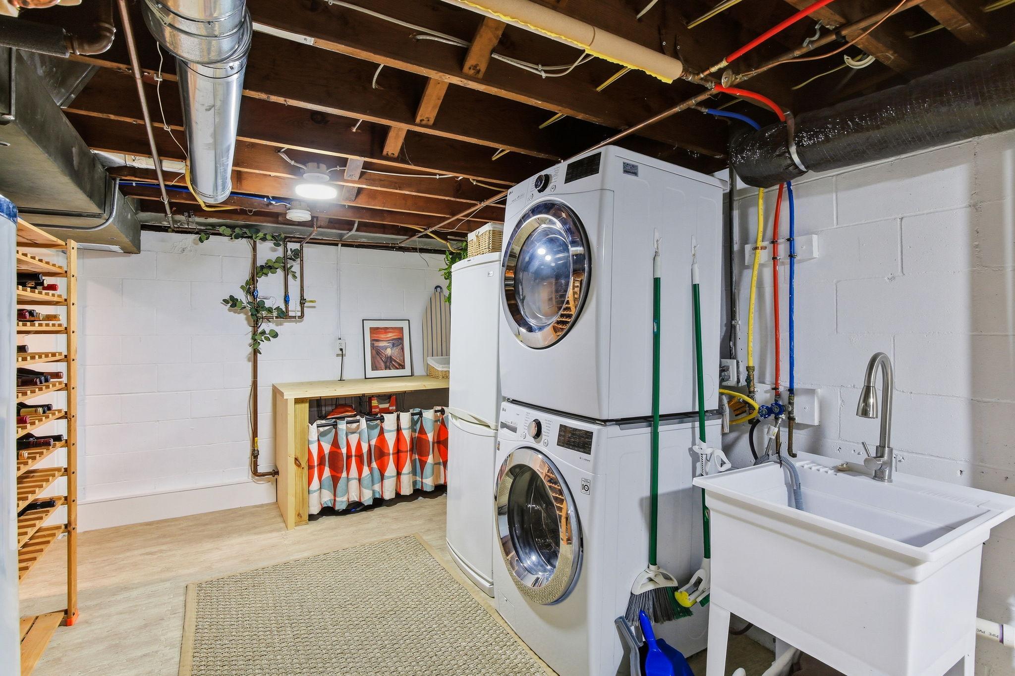Bright and clean laundry room and lots of storage space downstairs!