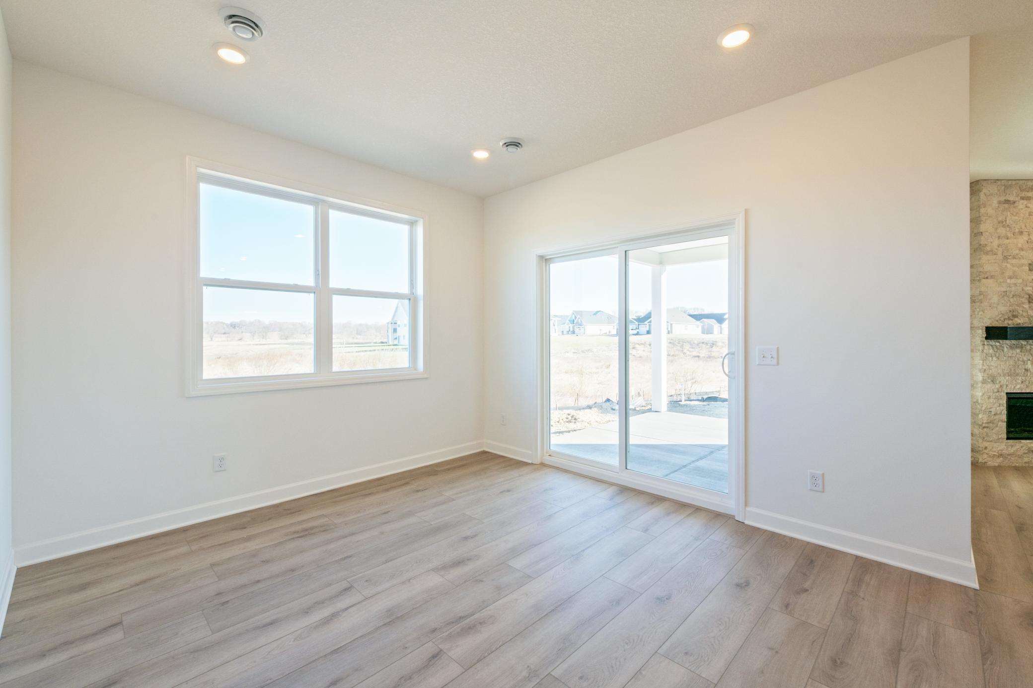 (Photo of a similar home, actual finishes may vary) Enjoy simple access to the dining room off the kitchen when preparing and serving home-cooked meals.