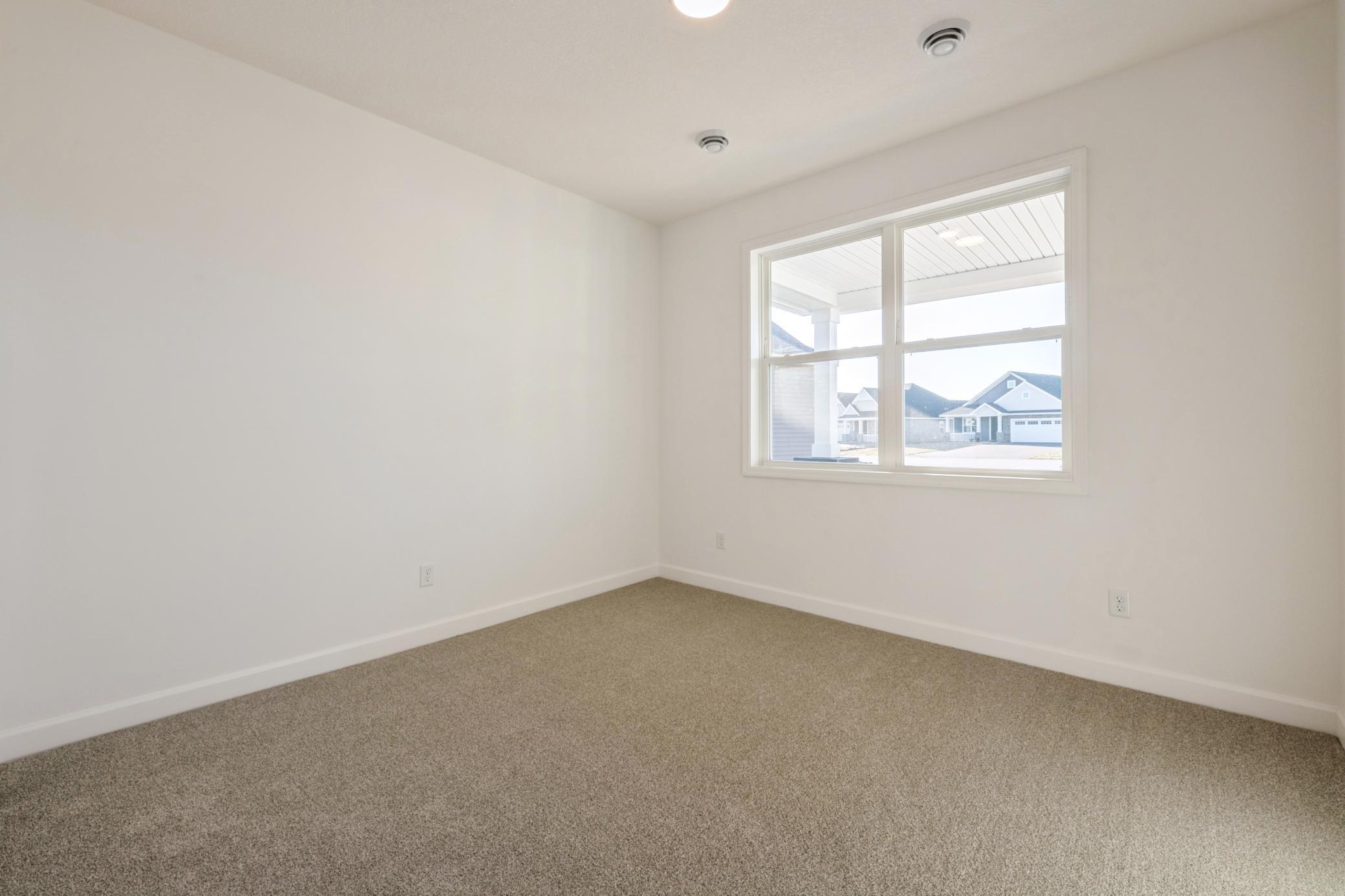 (Photo of a similar home, actual finishes may vary) The walk-in closet offers ample wardrobe storage and is accessible through the owner’s suite bathroom