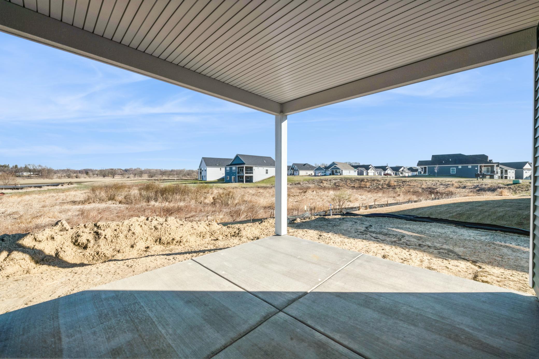 (Photo of a similar home, actual finishes may vary) The patio is the perfect place to rest and unwind while enjoying a beautiful day.