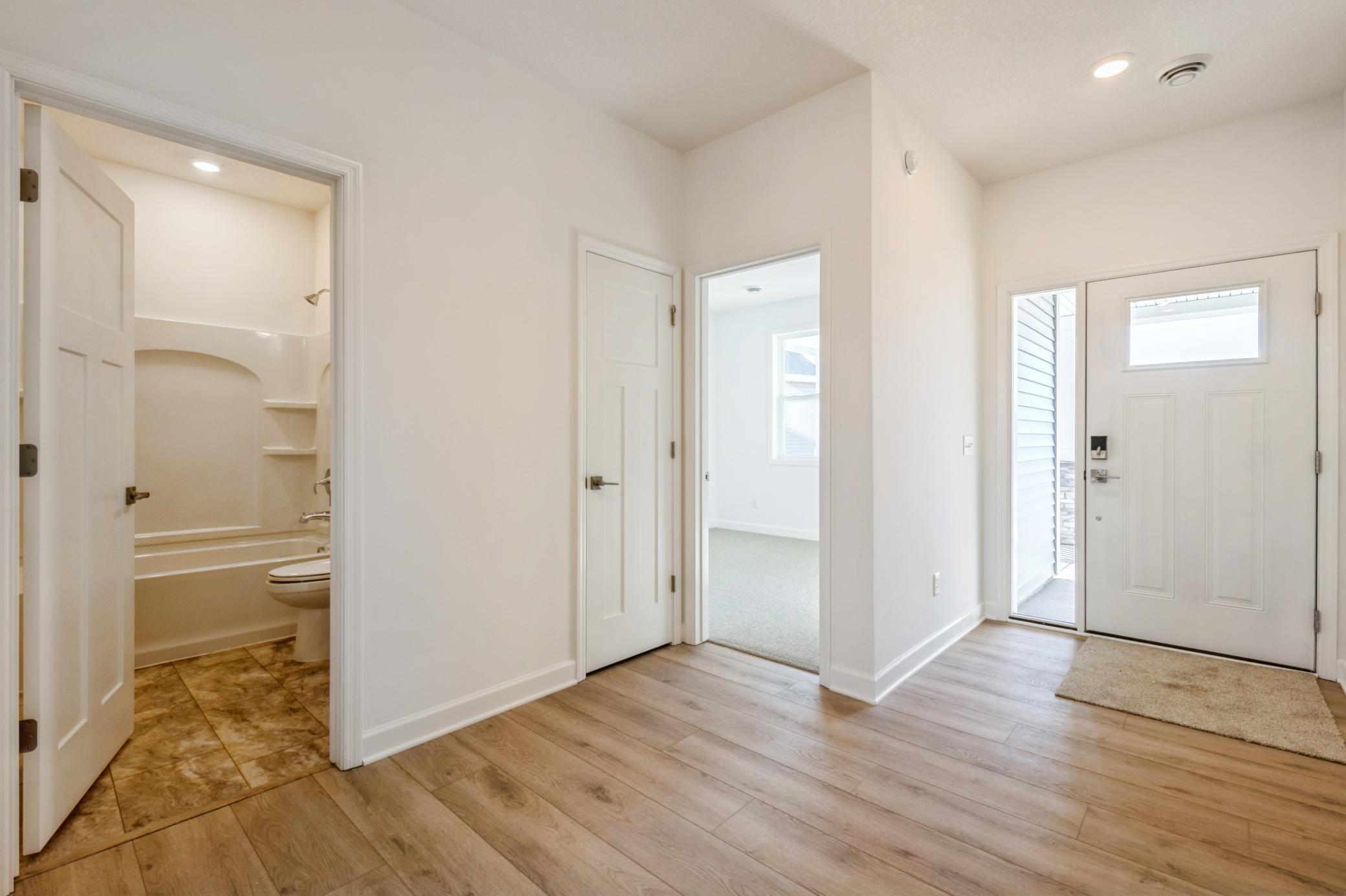 (Photo of a similar home, actual finishes may vary) A look off the foyer.