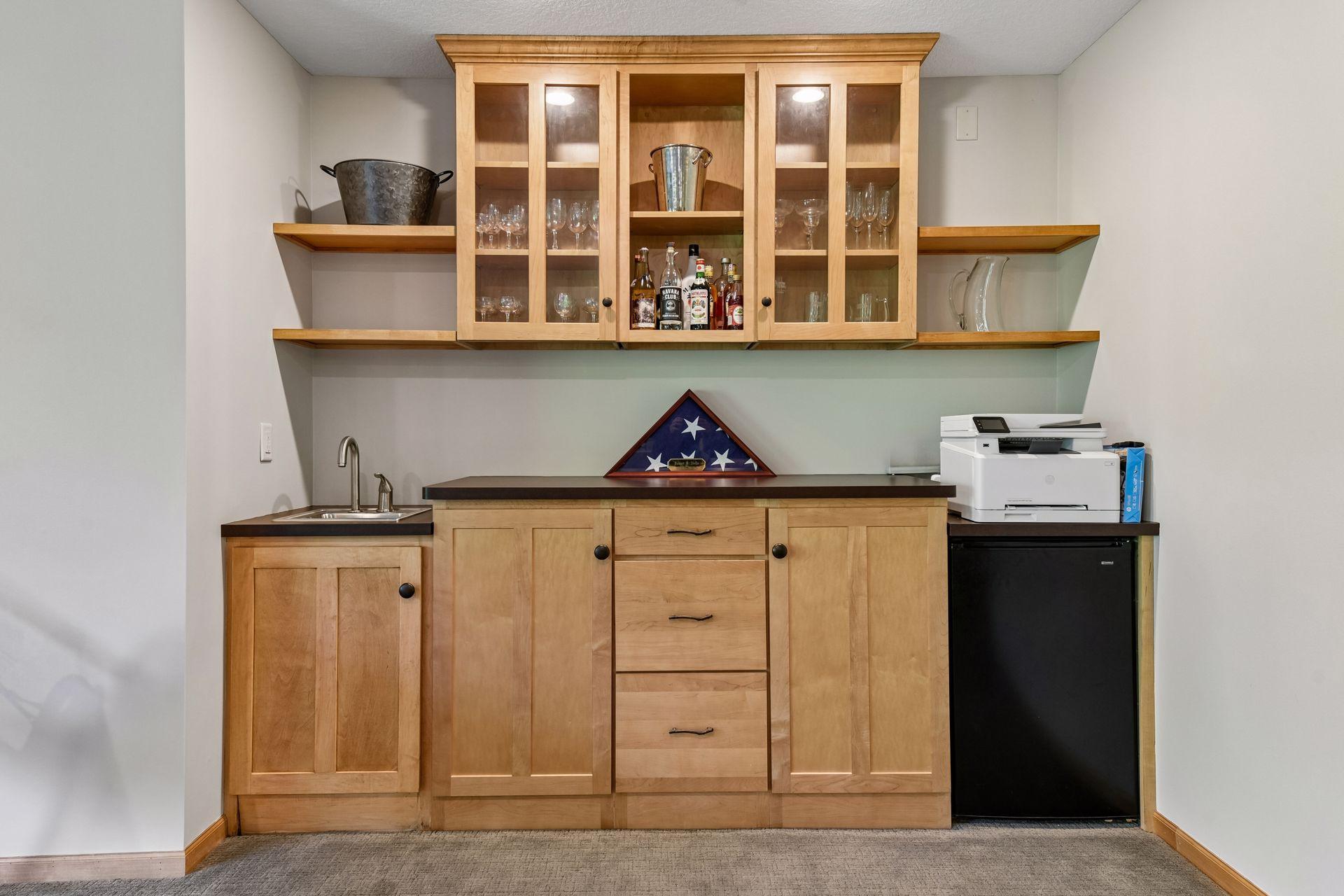 Downstairs wet bar and refrigerator, no need to run upstairs to get your beverages while entertaining!