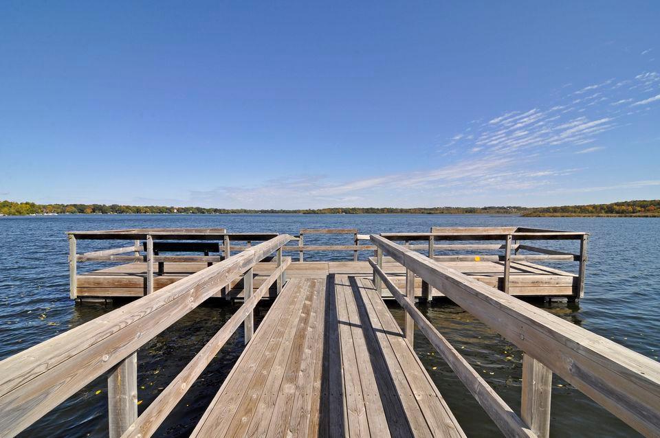 Fishing pier next to the beach on Lake Minnewashta