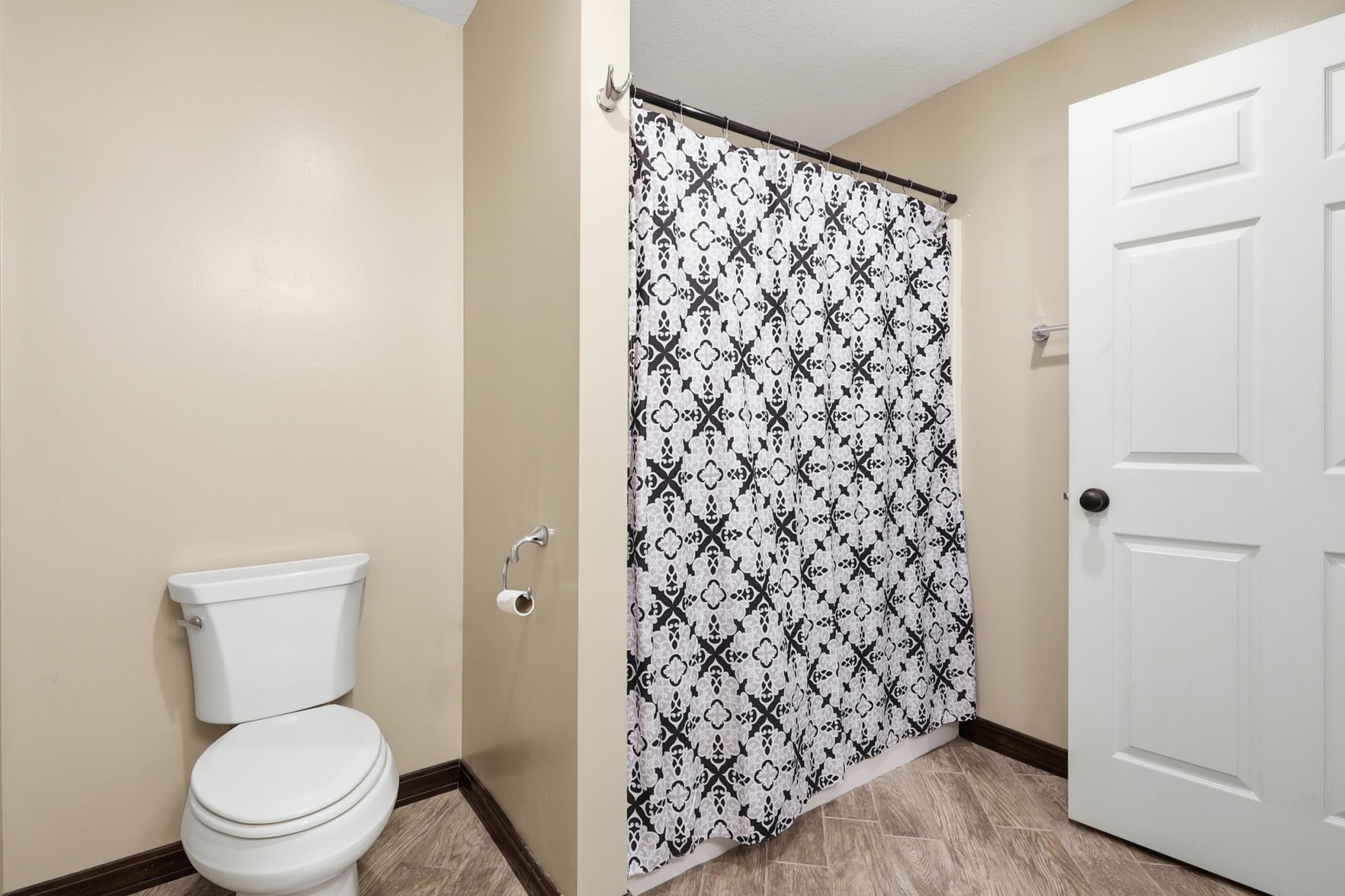 The lower level full bath boasts heated floors