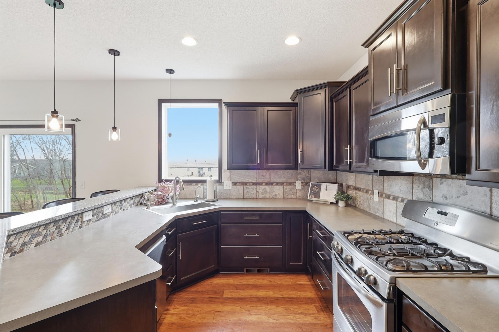 Rich cabinetry and loads of counter space