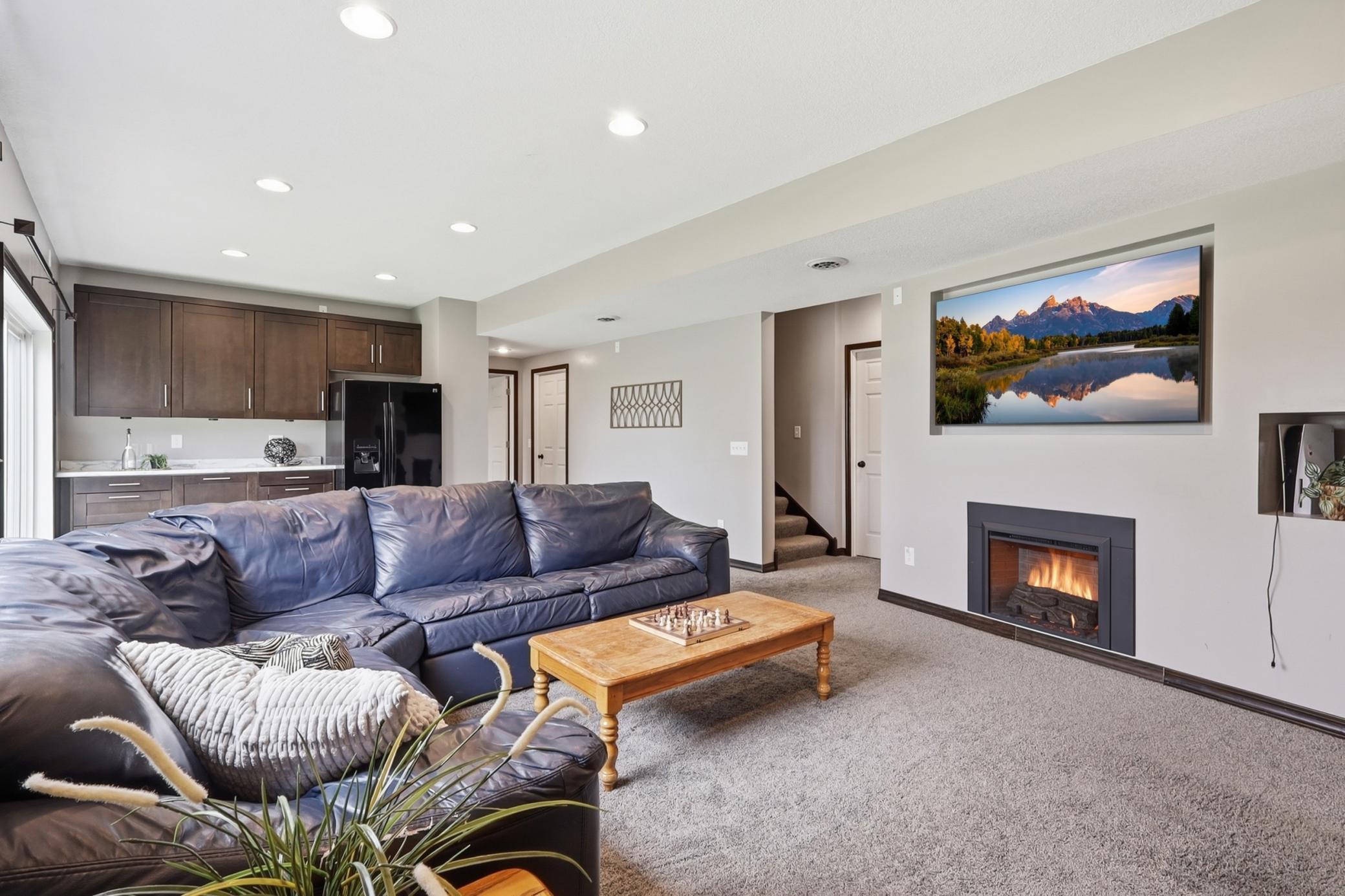 Walkout lower level family room with gas fireplace